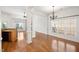 Spacious living room with hardwood floors, decorative columns, and natural light at 4116 Argyle Trl, Burlington, NC 27215