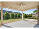 This covered patio features a ceiling fan and a lovely view of the landscape at 4116 Argyle Trl, Burlington, NC 27215