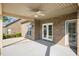 Covered patio featuring a ceiling fan, brick columns, and access to the home and backyard at 4116 Argyle Trl, Burlington, NC 27215