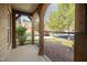 Cozy porch with sun shades, offering a comfortable and shaded outdoor space, overlooking the front yard at 4116 Argyle Trl, Burlington, NC 27215