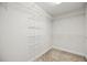 Large walk-in closet with carpet flooring and white shelving on all sides at 4116 Argyle Trl, Burlington, NC 27215