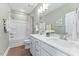 Bright bathroom with double sink vanity, modern fixtures, and wood-look flooring at 412 Gaston Park Ln # 200, Wake Forest, NC 27587