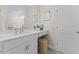 Bright bathroom vanity with white cabinets, quartz countertop, decor, and a round stool beneath at 412 Gaston Park Ln # 200, Wake Forest, NC 27587
