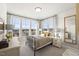 Cozy bedroom with large windows, neutral decor, and stylish furnishings at 412 Gaston Park Ln # 200, Wake Forest, NC 27587