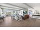 Open living room with hardwood floors, fireplace, television and a patio with seating at 412 Gaston Park Ln # 200, Wake Forest, NC 27587