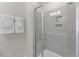 Tiled shower with a glass door and built in shelves in a modern bathroom at 414 Gaston Park Ln # 200, Wake Forest, NC 27587