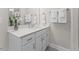 Bathroom featuring a white vanity with gray backsplash, undermount sink and neutral tones at 414 Gaston Park Ln # 200, Wake Forest, NC 27587
