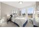 Cozy bedroom with modern decor, large window and artwork at 414 Gaston Park Ln # 200, Wake Forest, NC 27587