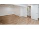 Finished basement with vinyl floors and ample room for storage at 4205 Woodlawn Dr, Raleigh, NC 27616