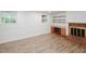 Basement featuring a fireplace, built in shelving, and a window at 4205 Woodlawn Dr, Raleigh, NC 27616
