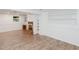 Finished basement with built-in shelving, fireplace and vinyl flooring at 4205 Woodlawn Dr, Raleigh, NC 27616
