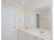 Bright bathroom featuring a double vanity, large mirror and glass shower at 4205 Woodlawn Dr, Raleigh, NC 27616