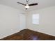 A bedroom featuring hardwood floors, neutral walls, and natural light at 4205 Woodlawn Dr, Raleigh, NC 27616