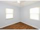 Cozy bedroom with hardwood floors, ceiling fan and natural light at 4205 Woodlawn Dr, Raleigh, NC 27616