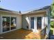 Spacious deck with sliding glass doors offers backyard views at 4205 Woodlawn Dr, Raleigh, NC 27616