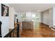 Spacious eat-in kitchen with granite countertops, stainless steel appliances, and hardwood floors at 4205 Woodlawn Dr, Raleigh, NC 27616