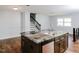 Bright kitchen with hardwood floors, stainless steel appliances, island, and an open concept design at 4205 Woodlawn Dr, Raleigh, NC 27616
