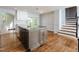Spacious eat-in kitchen with granite countertops, stainless steel appliances, and hardwood floors at 4205 Woodlawn Dr, Raleigh, NC 27616
