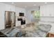 Updated kitchen with stainless steel appliances, white cabinets, and a large center island sink at 4205 Woodlawn Dr, Raleigh, NC 27616