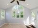 Bright room featuring tile flooring, large windows, neutral walls, and a ceiling fan at 4205 Woodlawn Dr, Raleigh, NC 27616