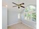 Bright room with tile flooring, white trim, neutral walls, and a ceiling fan at 4205 Woodlawn Dr, Raleigh, NC 27616