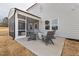Backyard patio with outdoor seating and a fireplace, perfect for cozy outdoor gatherings and enjoying cool evenings at 429 Providence Springs Ln, Fuquay Varina, NC 27526