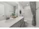 Modern bathroom featuring a double vanity, framed mirror and tub and shower combo at 429 Providence Springs Ln, Fuquay Varina, NC 27526