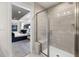 Beautiful bathroom with a walk-in shower with gray tiling and access to main bedroom at 429 Providence Springs Ln, Fuquay Varina, NC 27526
