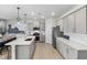 Kitchen with stainless steel appliances, a large quartz island, and ample cabinet space at 429 Providence Springs Ln, Fuquay Varina, NC 27526