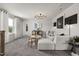 Open loft space showcasing modern decor, plush seating, and stylish lighting fixtures at 429 Providence Springs Ln, Fuquay Varina, NC 27526
