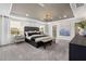 Spacious bedroom with a stylish chandelier, a tray ceiling, and a lake view at 429 Providence Springs Ln, Fuquay Varina, NC 27526