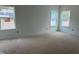 Bedroom with natural light streaming through two windows, ready for personalization at 4317 Emeline Way # 12, Fuquay Varina, NC 27526