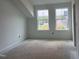 Bedroom with two large windows offering views and bright natural light at 4317 Emeline Way # 12, Fuquay Varina, NC 27526