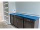 Kitchen with dark wood cabinets, light countertop, and open shelving at 4317 Emeline Way # 12, Fuquay Varina, NC 27526