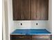 Unfinished kitchen features abundant cabinet storage and white counter top space at 4317 Emeline Way # 12, Fuquay Varina, NC 27526