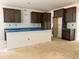 Spacious kitchen features abundant cabinet storage, countertop space and kitchen island at 4317 Emeline Way # 12, Fuquay Varina, NC 27526