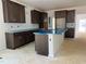 Spacious kitchen includes ample counter space, abundant cabinet storage, and a large island at 4317 Emeline Way # 12, Fuquay Varina, NC 27526