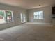 Unfinished living area featuring multiple windows and a glass door leading to the backyard at 4317 Emeline Way # 12, Fuquay Varina, NC 27526