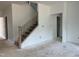 Staircase features wood steps and wooden handrail with iron spindles at 4317 Emeline Way # 12, Fuquay Varina, NC 27526