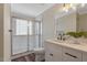 Bathroom featuring a glass shower, modern vanity, and ample counter space at 4902 Cedar Glen Dr, Durham, NC 27713