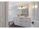Bathroom with double sink vanity, framed mirror and walk-in shower at 4902 Cedar Glen Dr, Durham, NC 27713