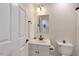 Bathroom with a vanity, mirror, and toilet, featuring modern fixtures and a clean design at 4902 Cedar Glen Dr, Durham, NC 27713