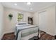 Bright bedroom features wood floors, closet, and large window allowing for natural light at 4902 Cedar Glen Dr, Durham, NC 27713