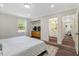 Spacious main bedroom with hardwood floors, a dresser, and a walk-in closet at 4902 Cedar Glen Dr, Durham, NC 27713