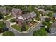 Stunning aerial view of a beautiful brick home with lush landscaping and mature trees at 5619 Bennettwood Ct, Raleigh, NC 27612
