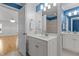 The bathroom features tile flooring, and a white dual sink vanity with white fixtures at 5619 Bennettwood Ct, Raleigh, NC 27612