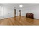 An expansive, light-filled bedroom with gleaming hardwood floors, and access to an attached bathroom is move-in ready at 5619 Bennettwood Ct, Raleigh, NC 27612