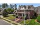 Charming two-story brick home with well-manicured lawn and a welcoming front porch at 5619 Bennettwood Ct, Raleigh, NC 27612