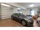 Garage interior with a vehicle, storage cabinets, and a bright, well-lit space at 5619 Bennettwood Ct, Raleigh, NC 27612