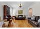 Cozy living room with hardwood floors, vintage desk, and a comfortable seating arrangement at 5619 Bennettwood Ct, Raleigh, NC 27612